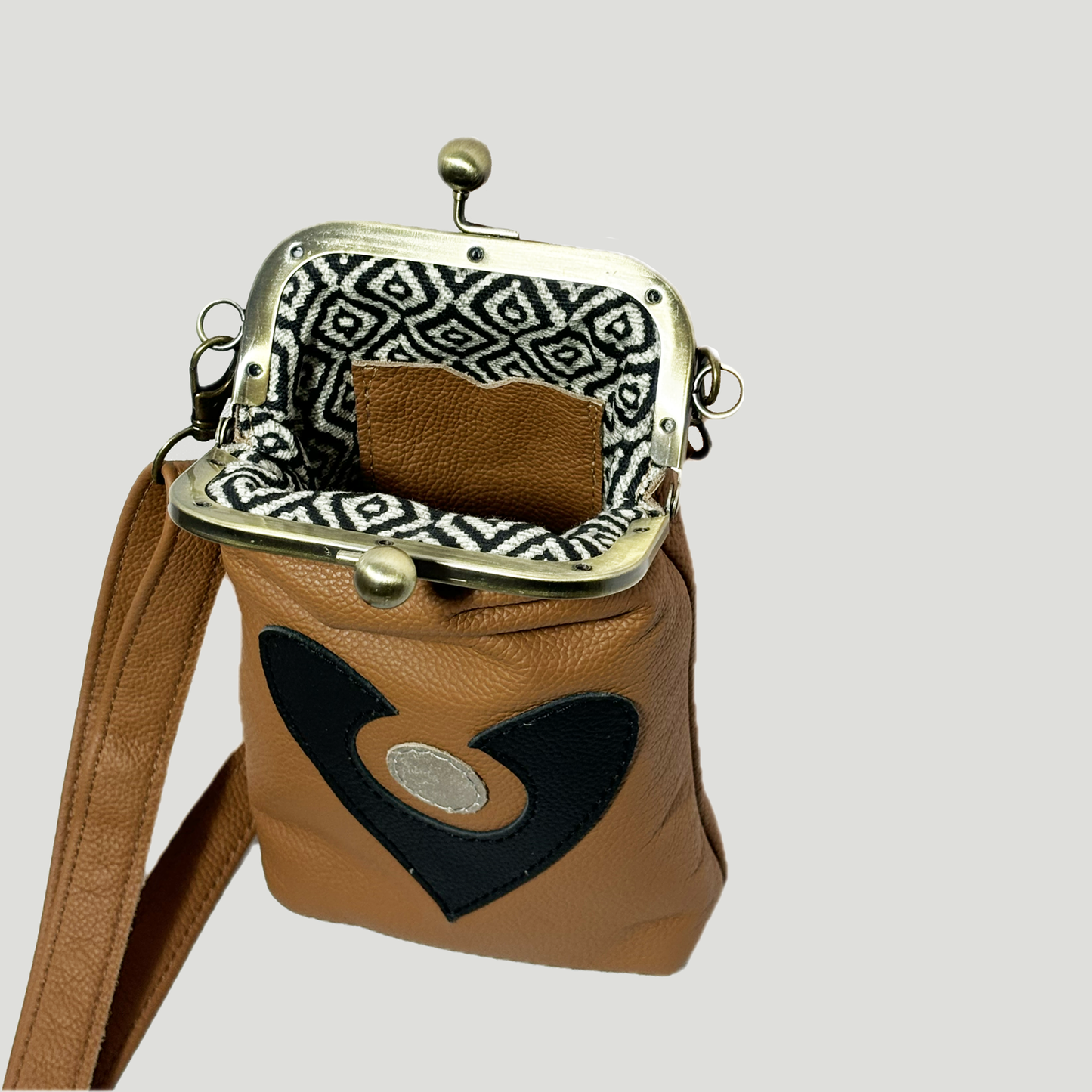 Phone Crossbody with elephant applique cognac with black and gold abstract heart